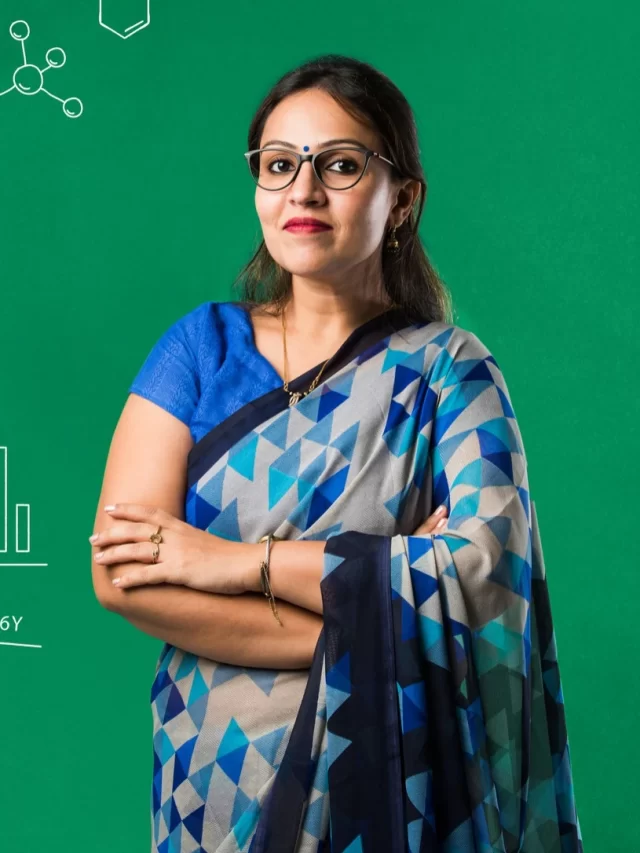 portrait-indian-lady-teacher-saree-stands-against-green-white-blackboard