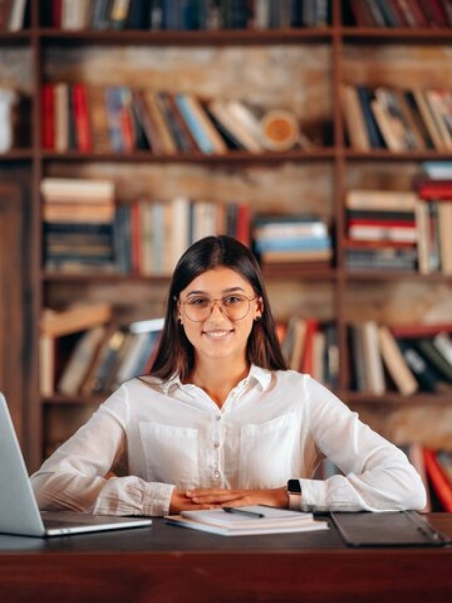 young-beautiful-business-woman-glasses-sits-work-table_1153-9278